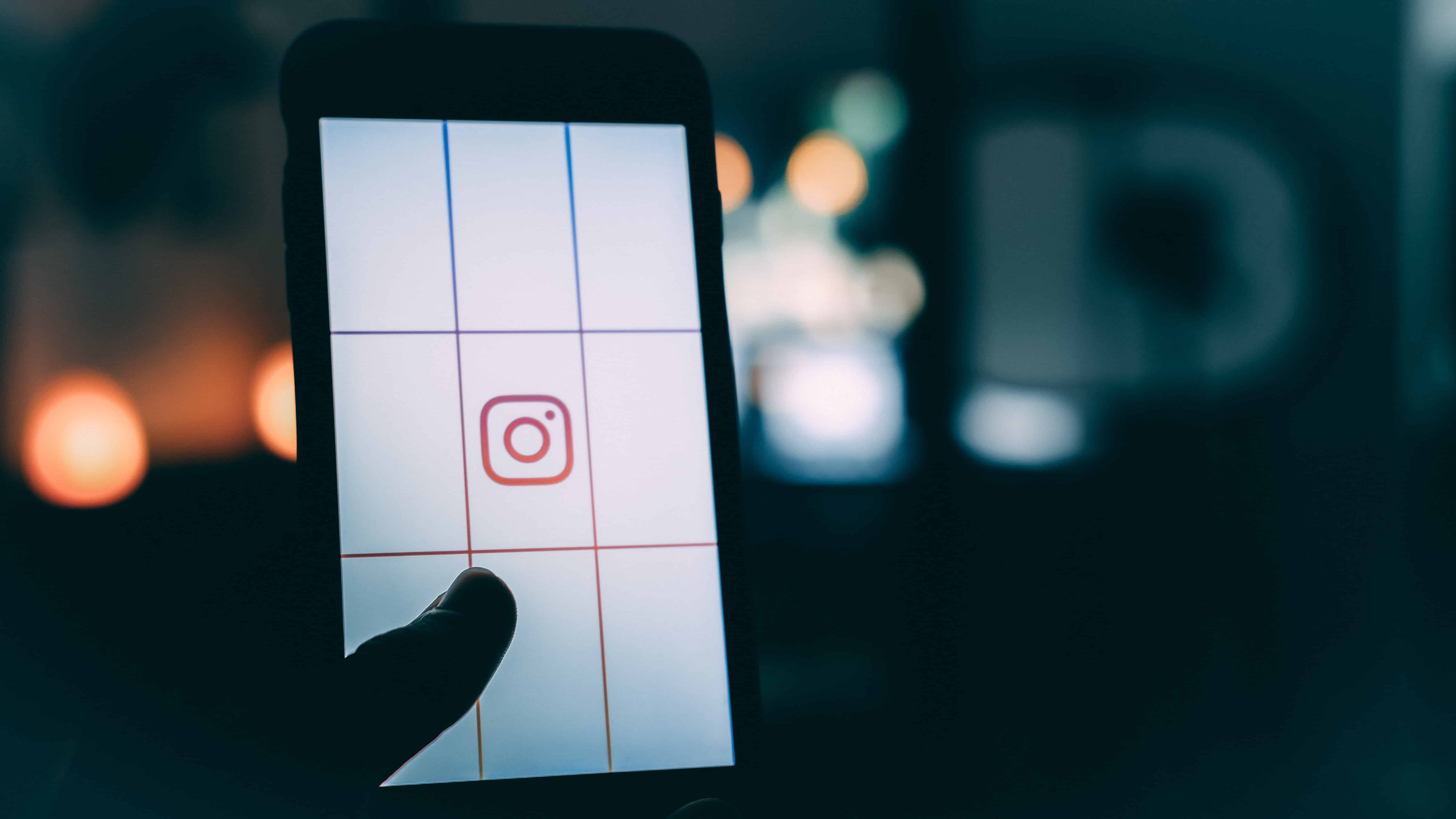 Phone with grid and Instagram Logo